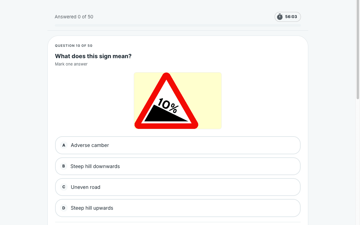 The mock test running on a laptop, showing a road sign question with four answers.